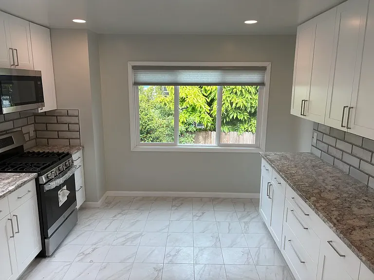 Spacious kitchen with new flooring