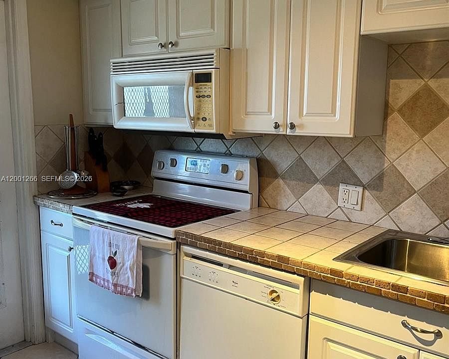 1st image of 3200 N Palm Aire Dr APT 407