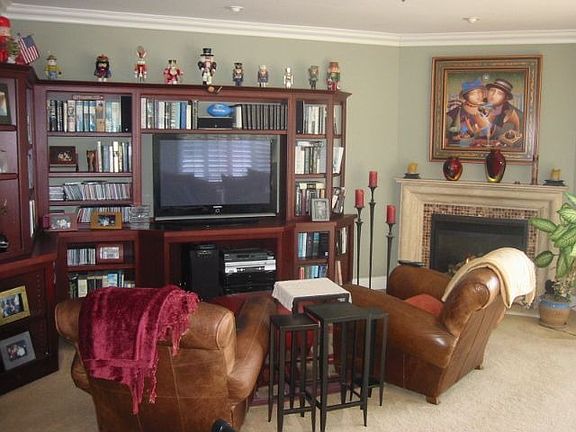 Beautiful cherry wood shelving and entertainmnet center.