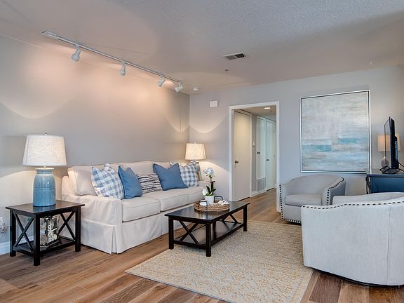 Comfortable living area includes HD TV with cable.