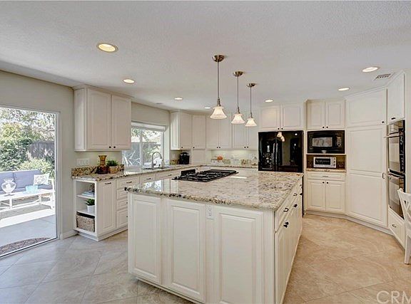Expanded Kitchen, with a large Granite Island for Entertaining. This kitchen offers Refinished cabin