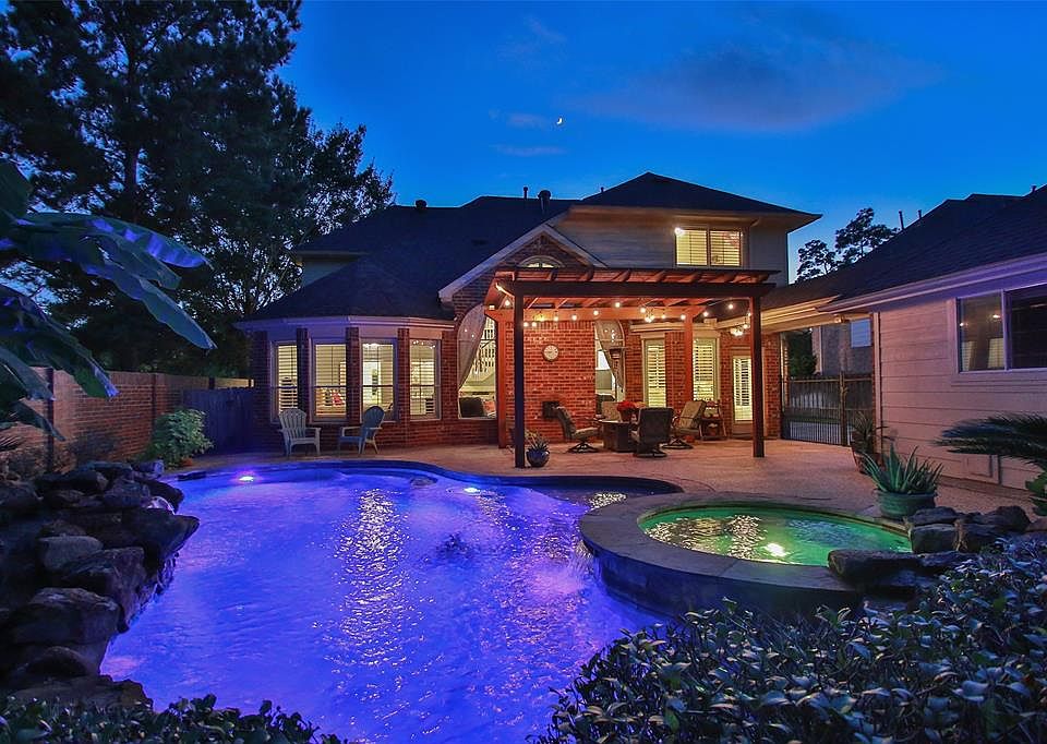 Entertain or family time around this chlorine pool with spa. Multiple colored lights options. Pergola and detached oversized garage.