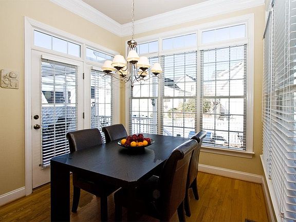The breakfast room has a french door and enough windows to be a sunroom.
