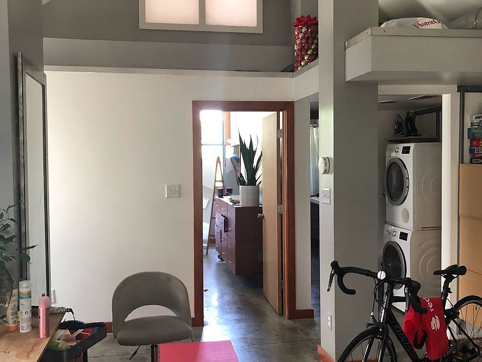 First Floor Studio Space looking towards Bedroom and Laundry area. Cathedral Ceilings. Plenty of Daylight