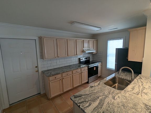 Kitchen and front entrance.