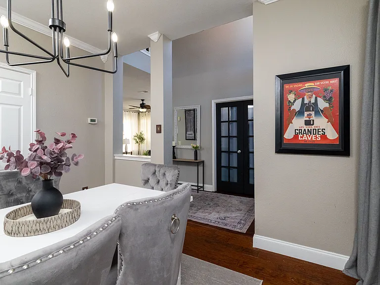 Elegant formal dining room with plush velvet seating, perfect for group dinners.
