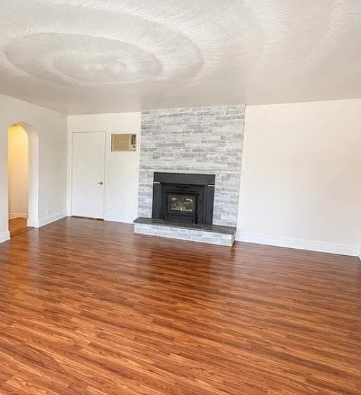 wood burning fireplace in living room - digitally altered to remove personal belongings