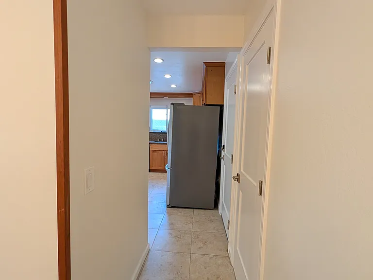 Passage from dining room to kitchen.