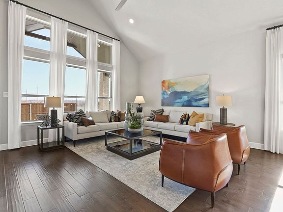 Living room in the Greenbrier home plan by Trophy Signature Homes - REPRESENTATIVE PHOTO