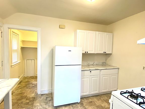 Updated Kitchen Leading to Large Pantry or Potential Office Space with Window