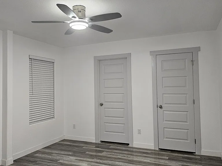 Principal Bedroom
Bath (left); closet (right) doors