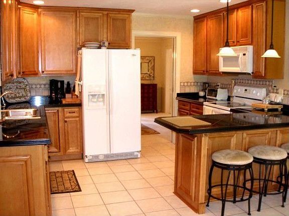 Newly updated kitchen with 42" cabinets and granite counters