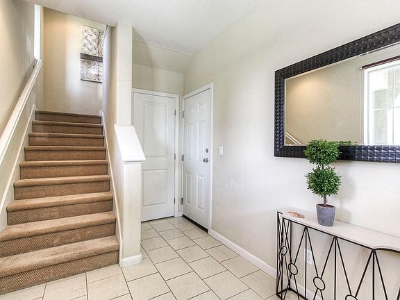Foyer with storage and access to garage