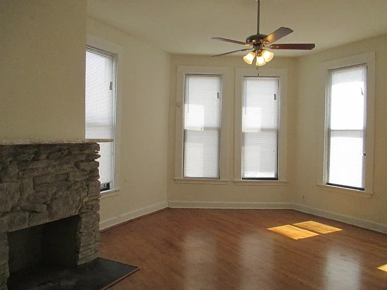 Fabulous Living room w Large window with Decorative Fireplace