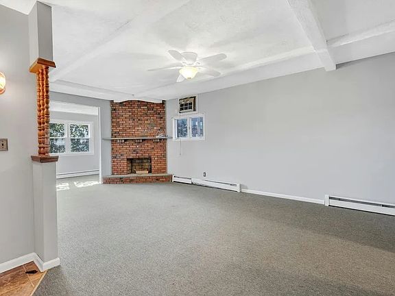 Living Room/ Dining Room 2 with Non Functional Brick Fireplace.