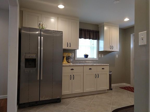 Cheerful kitchen featuring stainless steel appliances