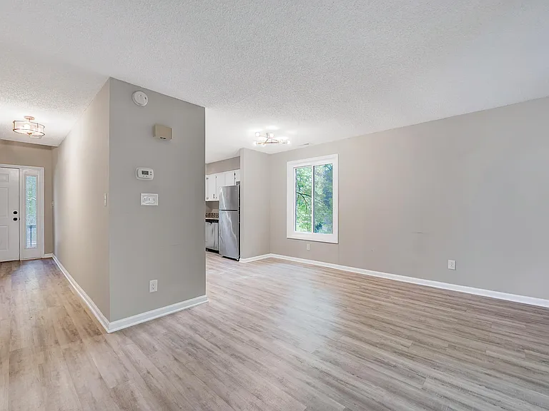 Front door is on the left which leads you in almost a U shape for the kitchen area