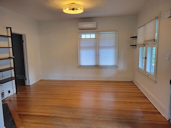 Spacious living room with built in shelving
