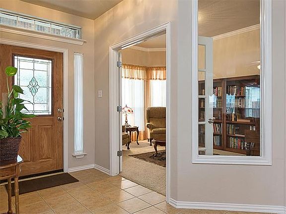 Wonderful library with French doors off of main entrance.