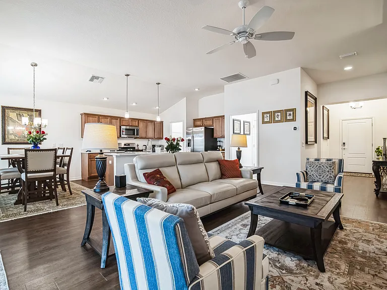 A view of the View of the Living Room, Dining Room, Kitchen, and Main Hallway to the Front Door.