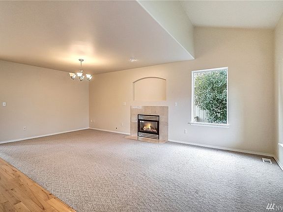 The blended formal living and dining room both can enjoy the warm fireplace.