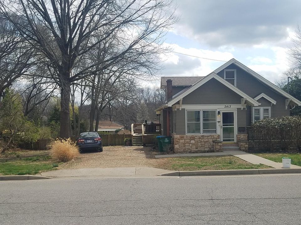 The bungalow with driveway and fence to back yard