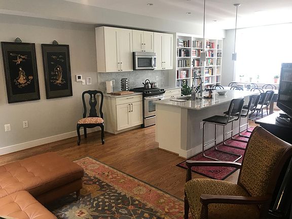 Note that this home is currently unfurnished. First floor features open layout with kitchen, dining and living space all connected. Massive windows along back welcome abundance of light and display view of expansive private back patio.