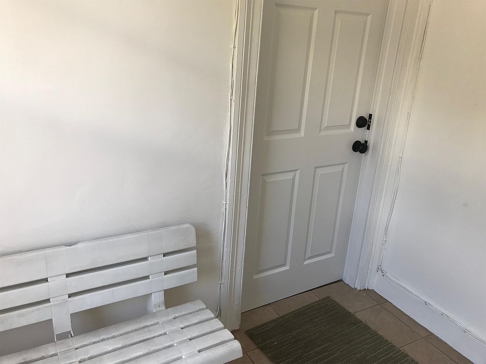 Front door with waiting area and bench
