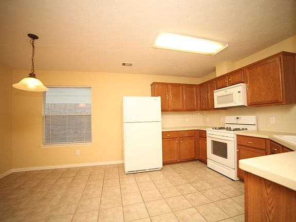 Plenty of room and cabinets in the kitchen. Refrigerator, M