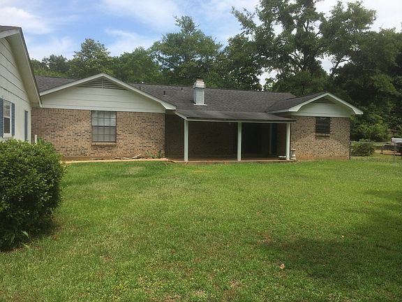 Rear of home with a covered patio