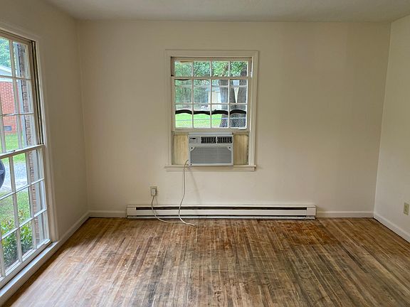 Living room. AC unit remains it belong to the former tenant.