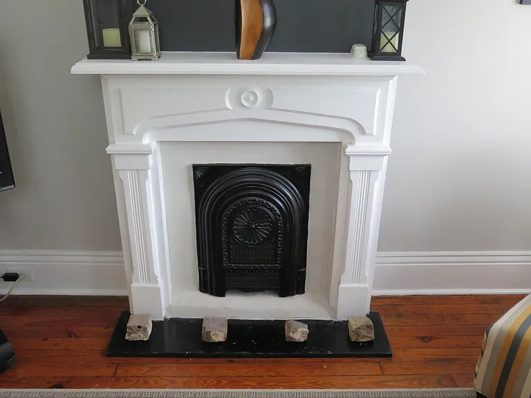 Original mantles, summer screen and brick relics salvaged during the renovation.