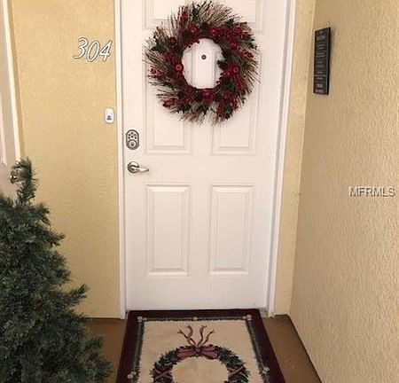 FRONT DOOR - INVITING - LARGE OUTDOOR STORAGE TOO ! STEPS TO THE ELEVATOR.