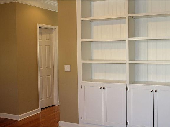 Living room facing build-in bookshelves
