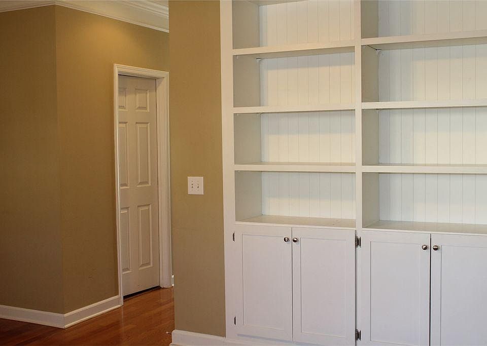 Living room facing build-in bookshelves