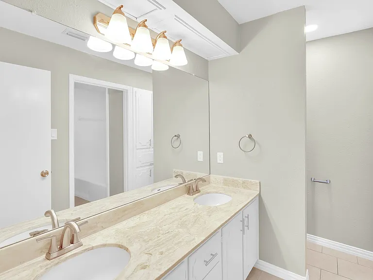 Guest bath with dual sinks, new hardware and faucets and locking door knobs.