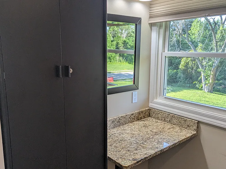 master walk in closet with ladies' vanity