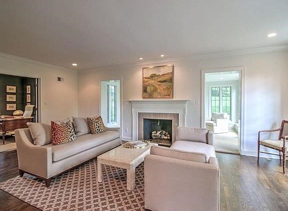Gracious living room with gas fireplace and lots of natural light.