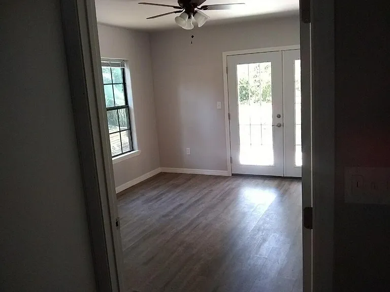 Master bedroom with French doors to back deck