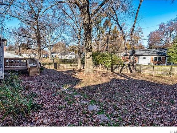 Large rear yard with fence could be a haven for any dog.