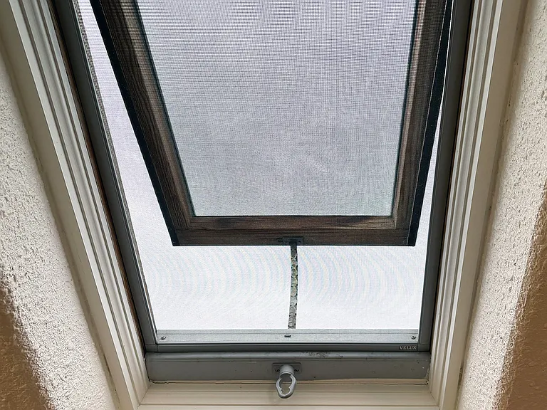 Living room skylight partially opens for cooling and/or letting a breeze in.