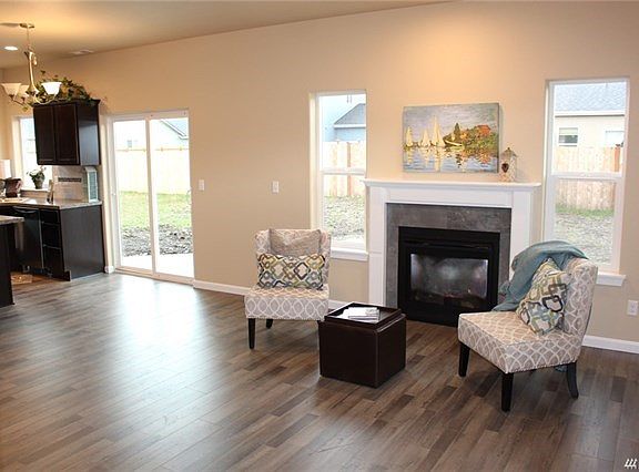 Light and airy great room with laminate floors throughout the main floor.  Gas/propane fireplace with mantel.