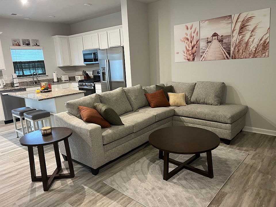 Sectional in den. All pillows included.