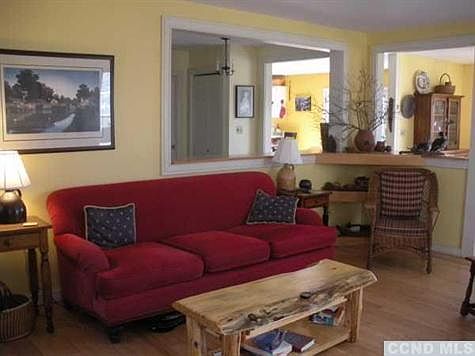 Living room is open to formal dining room and kitchen.