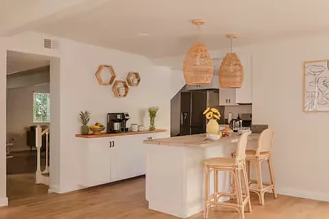 Bright and modern, this fully stocked kitchen features stainless steel appliances, spacious counters, and everything needed for easy meals.