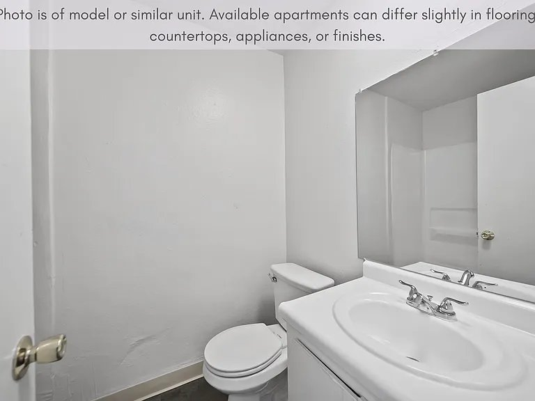 Bright bathroom with a full tub and plenty of counter space for everyday convenience.