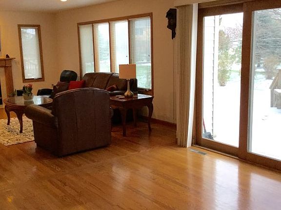 This shows the spacious eating area off the kitchen which flows openly to the family room - the patio doors lead to a deck which is great for outdoor picnics or grilling as the summer approaches