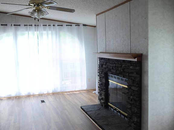 Wood fireplace in den