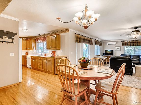 Dining area off of kitchen and family room with hardwood floors.