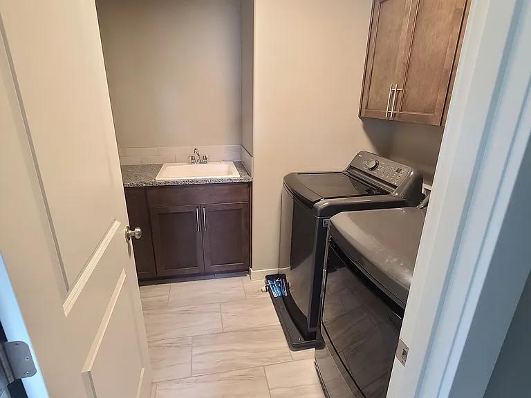 Upstairs washer/dryer + granite sink